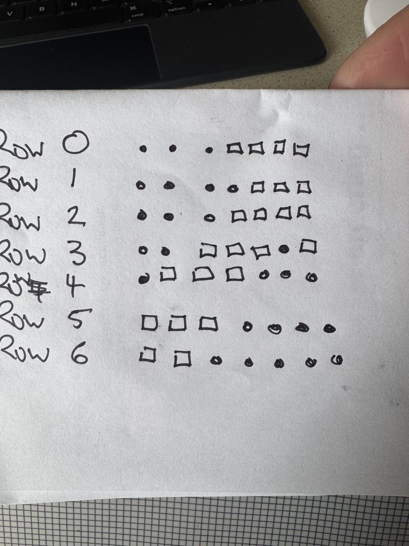 An early hand-drawn pixel grid sketch, testing shapes for the climb/descend arrows