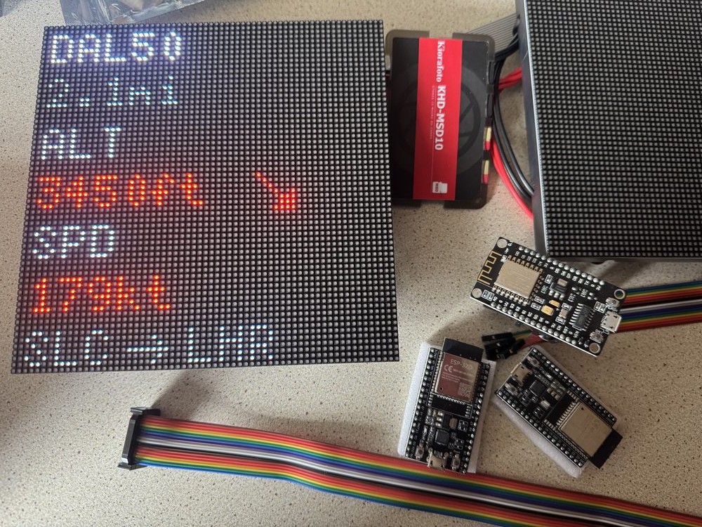 ESP32 development boards laid out on the bench next to the LED matrix panel